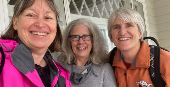 three ladies smiling